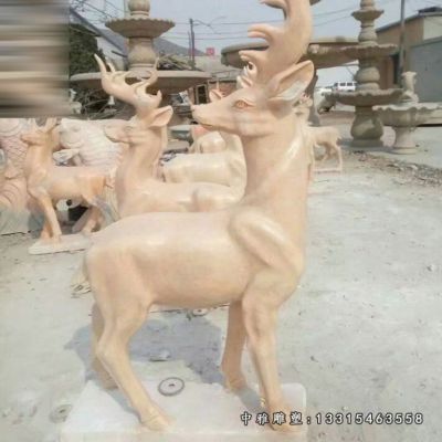 公园晚霞红石雕小鹿