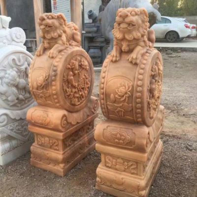 石雕晚霞红狮子抱鼓石